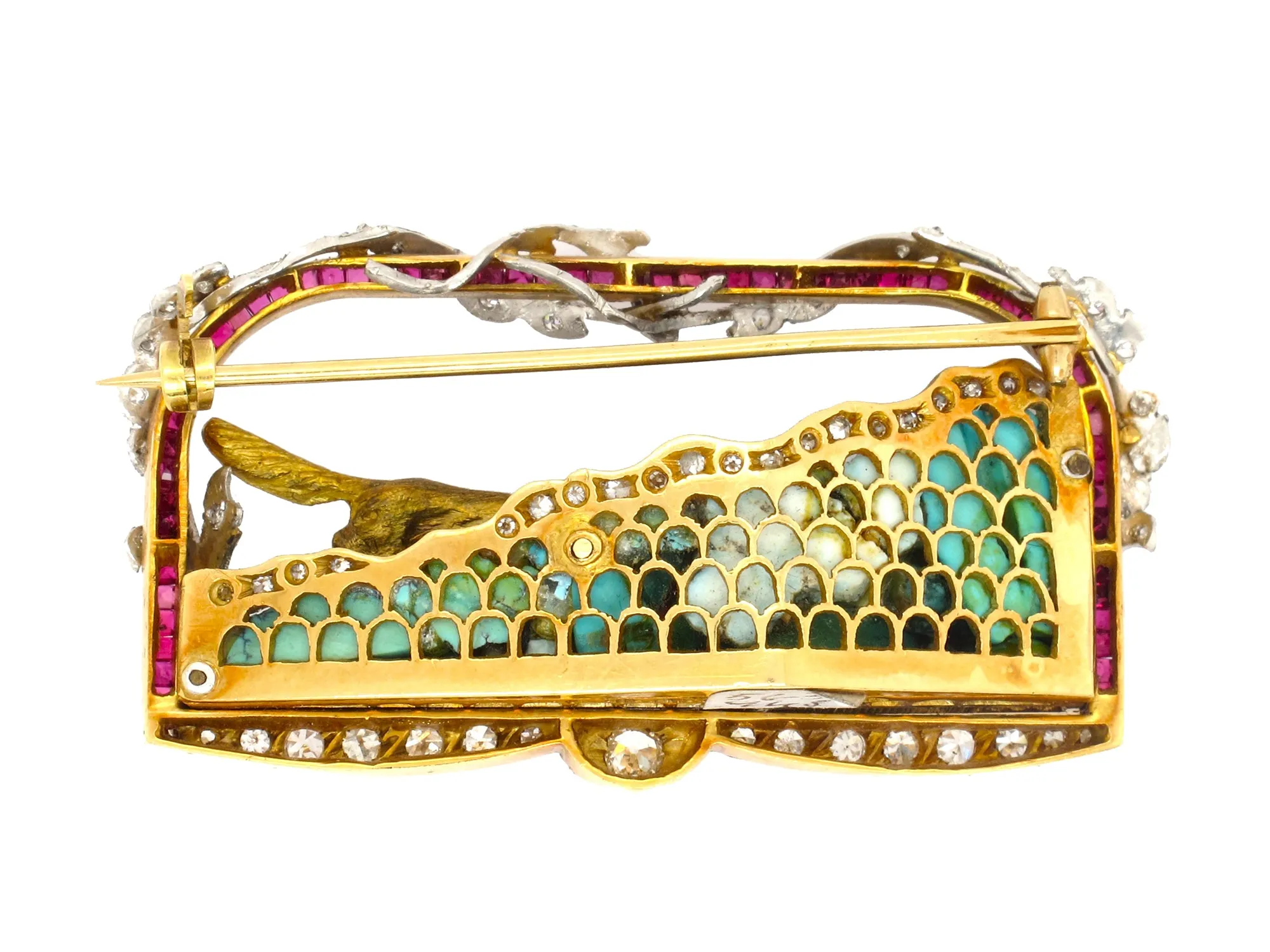 A very rare yellow gold and platinum brooch designed as a diamond and ruby frame. Italy 1940